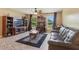 Inviting living room with natural light, tile floors, and comfortable seating at 929 Louvre Ct, Kissimmee, FL 34759