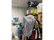 Basement storage area with clothing rack, shelves, and various items neatly arranged at 976 Alicante Ave, Orlando, FL 32807