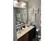 Cozy bathroom with a vanity and sink, complemented by decorative artwork and modern fixtures at 976 Alicante Ave, Orlando, FL 32807