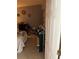 Spare bedroom featuring tiled floors, closet, pictures and decor on neutral-colored walls at 976 Alicante Ave, Orlando, FL 32807
