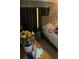 Bedroom featuring bed, dark curtains, wooden nightstand, and neutral-toned walls at 976 Alicante Ave, Orlando, FL 32807