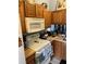 Kitchen featuring oven, microwave, countertop appliances and overhead cabinets at 976 Alicante Ave, Orlando, FL 32807
