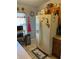 Kitchen with refrigerator, tile floor, and overhead cabinets at 976 Alicante Ave, Orlando, FL 32807