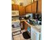 Kitchen with white appliances, laminate countertop, and tile floors at 976 Alicante Ave, Orlando, FL 32807