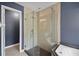 Contemporary bathroom featuring a glass shower with sleek, modern fixtures at 10697 Lake Hill Dr, Clermont, FL 34711
