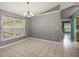 Spacious dining area featuring tile flooring and natural light at 10697 Lake Hill Dr, Clermont, FL 34711
