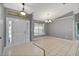 Bright foyer with tile flooring, neutral paint, and modern light fixtures at 10697 Lake Hill Dr, Clermont, FL 34711