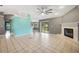 Open kitchen with wood cabinets, stainless appliances, and adjacent breakfast nook at 10697 Lake Hill Dr, Clermont, FL 34711
