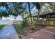 Outdoor lakeside bar featuring wooden decks, palm trees, and water views at 10697 Lake Hill Dr, Clermont, FL 34711