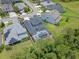 Aerial view of a fenced in yard featuring a screened-in pool, green space, and privacy at 1224 Hillcrest View Loop, Apopka, FL 32703