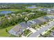 Aerial view of a lovely home with a pool, lush greenery, and surrounded by neighborhood amenities at 1224 Hillcrest View Loop, Apopka, FL 32703