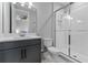 Clean bathroom features a shower with glass doors, toilet, and vanity at 1224 Hillcrest View Loop, Apopka, FL 32703