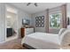Bright bedroom features a TV, dresser, decor, and window with a view at 1224 Hillcrest View Loop, Apopka, FL 32703