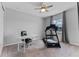 Spacious bedroom featuring a desk, chair, and treadmill for exercise at 1224 Hillcrest View Loop, Apopka, FL 32703