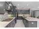Modern kitchen with stainless steel appliances, mosaic tile backsplash, and spacious island with seating at 1224 Hillcrest View Loop, Apopka, FL 32703