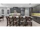 Stylish kitchen featuring stainless steel appliances and bar seating at 1224 Hillcrest View Loop, Apopka, FL 32703