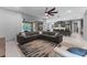 Open concept living room flowing into the kitchen and outdoor patio at 1224 Hillcrest View Loop, Apopka, FL 32703
