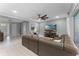 Spacious living room with large sectional sofa and bright natural light at 1224 Hillcrest View Loop, Apopka, FL 32703