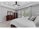 Spacious main bedroom featuring a tray ceiling, soft carpet, and natural light from three large windows at 1224 Hillcrest View Loop, Apopka, FL 32703
