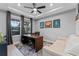 Serene office with tray ceiling, modern desk, and comfortable seating at 1224 Hillcrest View Loop, Apopka, FL 32703
