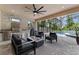 Covered patio with outdoor kitchen, fireplace, comfortable seating and gorgeous pool with spa at 1224 Hillcrest View Loop, Apopka, FL 32703
