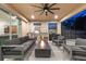 Inviting outdoor living area with a built-in grill, fire pit, and comfortable seating at 1224 Hillcrest View Loop, Apopka, FL 32703