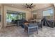 Inviting covered patio with outdoor kitchen, fire pit, and comfortable seating area at 1224 Hillcrest View Loop, Apopka, FL 32703