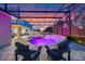 Backyard pool with waterfall features, jacuzzi, and lounge chairs under screened enclosure at 1224 Hillcrest View Loop, Apopka, FL 32703