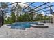 Beautifully landscaped pool and spa with screened enclosure for outdoor enjoyment at 1224 Hillcrest View Loop, Apopka, FL 32703