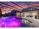 Stunning screened-in pool and spa with custom lighting and ample patio space for entertaining at 1224 Hillcrest View Loop, Apopka, FL 32703