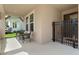Cozy porch with chairs and a secure gated entry enhances curb appeal at 1224 Hillcrest View Loop, Apopka, FL 32703