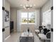 Cozy living room with ample natural light, elegant furnishings, and a view of the outdoors at 13521 Pearl Beach St, Winter Garden, FL 34787