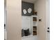 Inviting entryway with a custom bench, storage cubbies, and stylish decor at 13533 Pearl Beach St, Winter Garden, FL 34787
