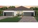 Charming single-story home showcasing a well-manicured lawn and a convenient two-car garage at 13533 Pearl Beach St, Winter Garden, FL 34787