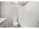 Bathroom featuring a vanity, toilet, and tiled shower/tub combo with decorative tile accents at 13848 Vista Del Lago Blvd, Clermont, FL 34711