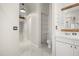 Well-lit bathroom with modern fixtures, elegant vanity, and convenient access to other areas of the home at 13848 Vista Del Lago Blvd, Clermont, FL 34711