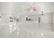 Spacious living room with bright lighting, featuring modern furnishings and an open layout with tile floors at 13848 Vista Del Lago Blvd, Clermont, FL 34711