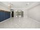 Open living area featuring ceramic tile flooring, recessed lighting, and a seamless flow into adjacent spaces at 13848 Vista Del Lago Blvd, Clermont, FL 34711