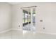 Well-lit room features sliding glass doors leading to the outdoor living area at 13848 Vista Del Lago Blvd, Clermont, FL 34711