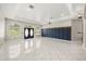 Expansive living space boasts natural light from arched windows and ceramic tile, blending elegance with a modern aesthetic at 13848 Vista Del Lago Blvd, Clermont, FL 34711