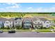 Two-story home showcasing a balcony, inviting curb appeal, and a front porch at 15133 Summer Harvest St, Winter Garden, FL 34787