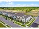 An aerial shot highlights a two-story home's ideal corner lot location and landscaping at 15133 Summer Harvest St, Winter Garden, FL 34787