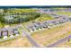 New townhome community featuring lovely landscaping and community pool near lush green spaces and pond at 15133 Summer Harvest St, Winter Garden, FL 34787