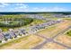 An aerial view shows a home with nearby community amenities and lush landscaping at 15133 Summer Harvest St, Winter Garden, FL 34787