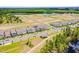 An aerial view of new home construction in a Gathering-friendly neighborhood with lake and community amenities at 15133 Summer Harvest St, Winter Garden, FL 34787