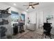 Bright bedroom featuring an artist's easel and a decorative ceiling fan at 15133 Summer Harvest St, Winter Garden, FL 34787