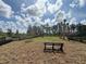 Community dog park with benches, fenced area, and lush landscaping on a sunny day at 15133 Summer Harvest St, Winter Garden, FL 34787