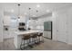 Bright kitchen with island, pendant lighting, stainless appliances, and sleek white cabinetry at 15133 Summer Harvest St, Winter Garden, FL 34787
