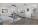 Open-concept living room featuring hardwood floors and neutral decor at 15133 Summer Harvest St, Winter Garden, FL 34787