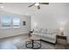Cozy living room with light hardwood floors and a comfortable sofa at 15133 Summer Harvest St, Winter Garden, FL 34787